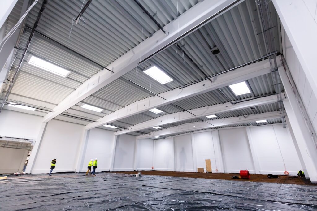 warehouse after roof leaks in heavy rain