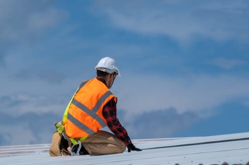 roofing contractor during commercial roof installation