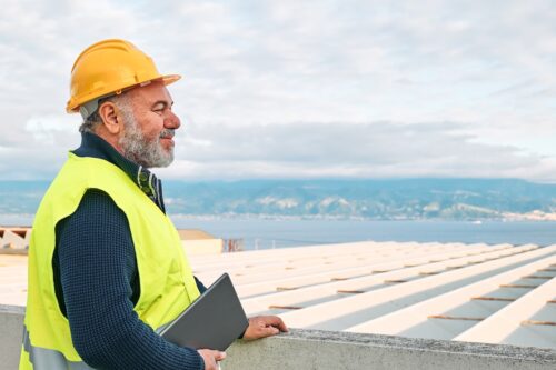 roofing expert evaluating commercial roofing project